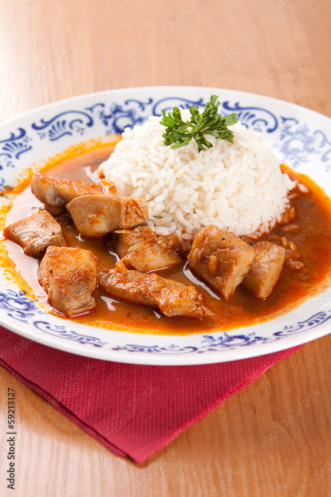 Fish goulash with rice and sauce