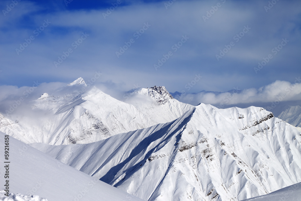 Off-piste slope and snowy mountains Off-piste slope and snowy mountains