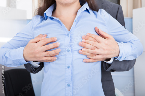 Businessman Touching Businesswoman