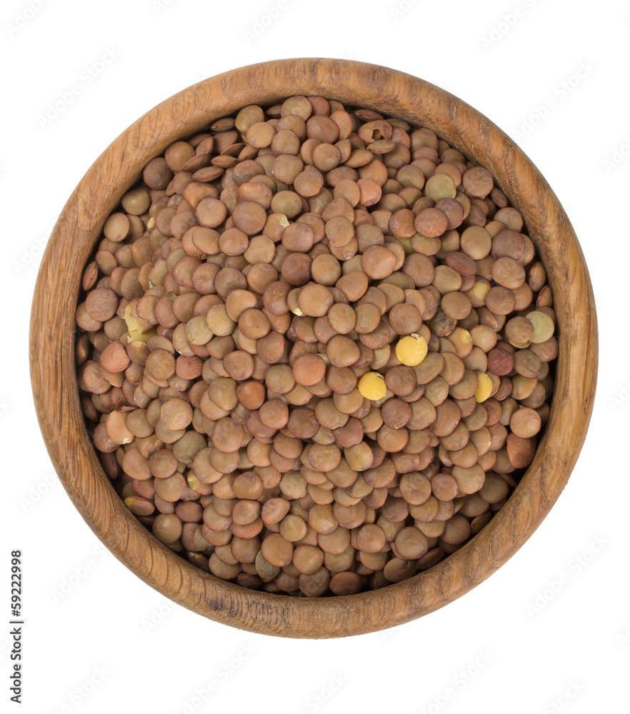 brown lentils in a woden bowl brown lentils in a woden bowl