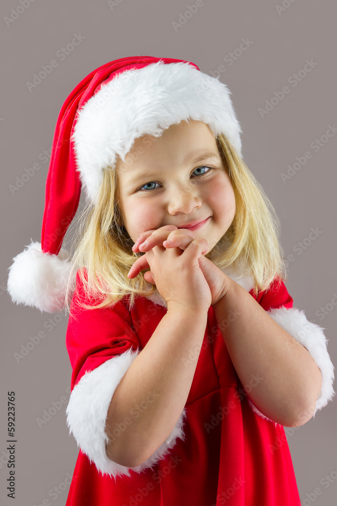 Portrait of a happy girl in a red new year cap Portrait of a happy girl in a red new year cap