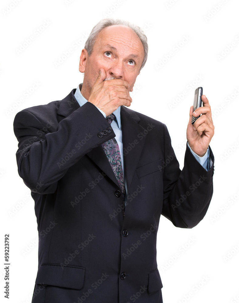 Shocked businessman with cell phone on a white background Shocked businessman with cell phone on a white background