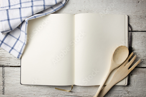 Blank recipe book on wooden table photo