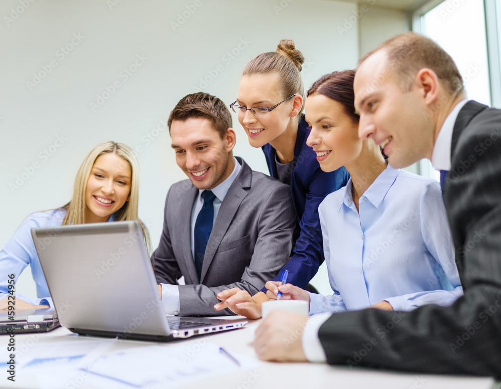 business team with laptop having discussion business team with laptop having discussion
