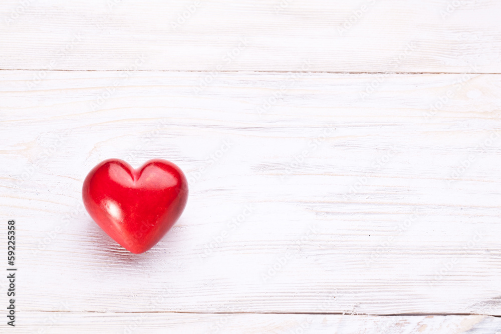 Valentines Day. Red heart on a wooden table. Valentines Day. Red heart on a wooden table.