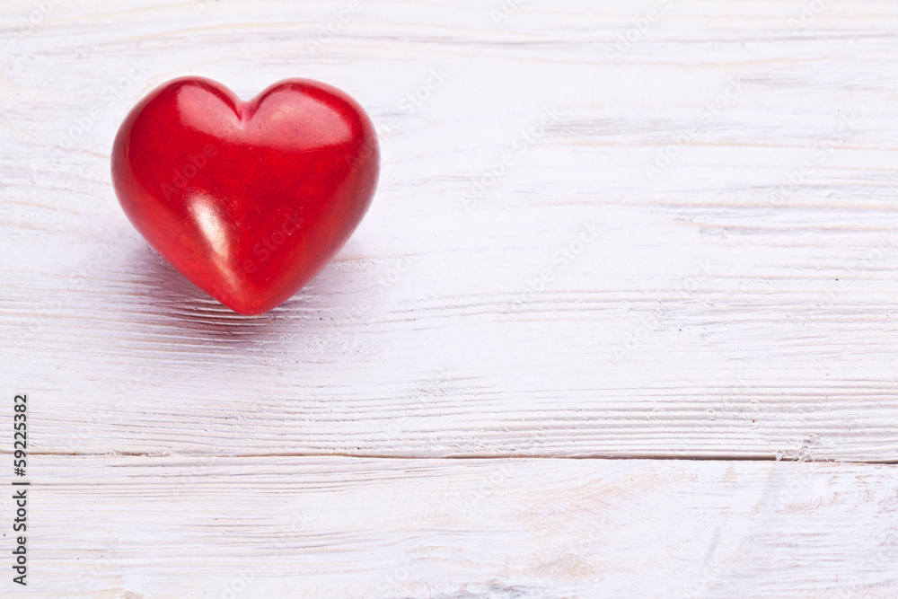 Valentines Day. Red heart on a wooden table. Valentines Day. Red heart on a wooden table.
