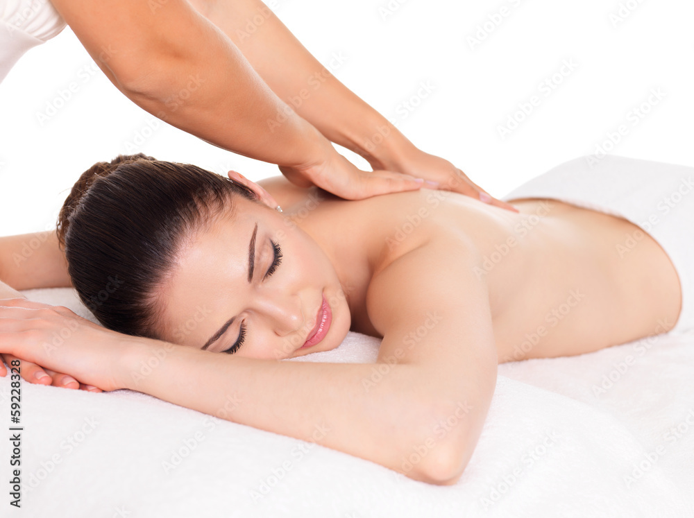 Woman having massage of body in spa salon