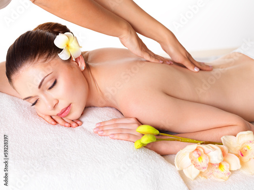 Woman having massage of body in spa salon