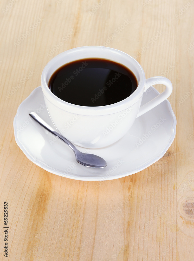 Coffee cup on wooden table close-up