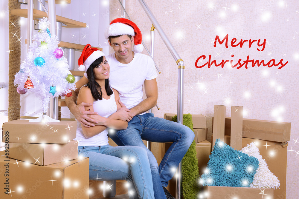 Obraz premium Young couple celebrating New Years in new home