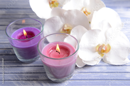 Fototapeta Naklejka Na Ścianę i Meble -  Beautiful colorful candles and  orchid flowers,