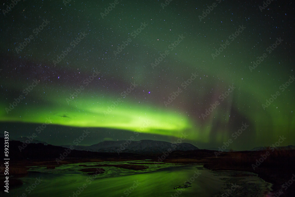 Northern Lights above river in Iceland