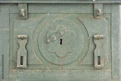 The old antique iron safe background.