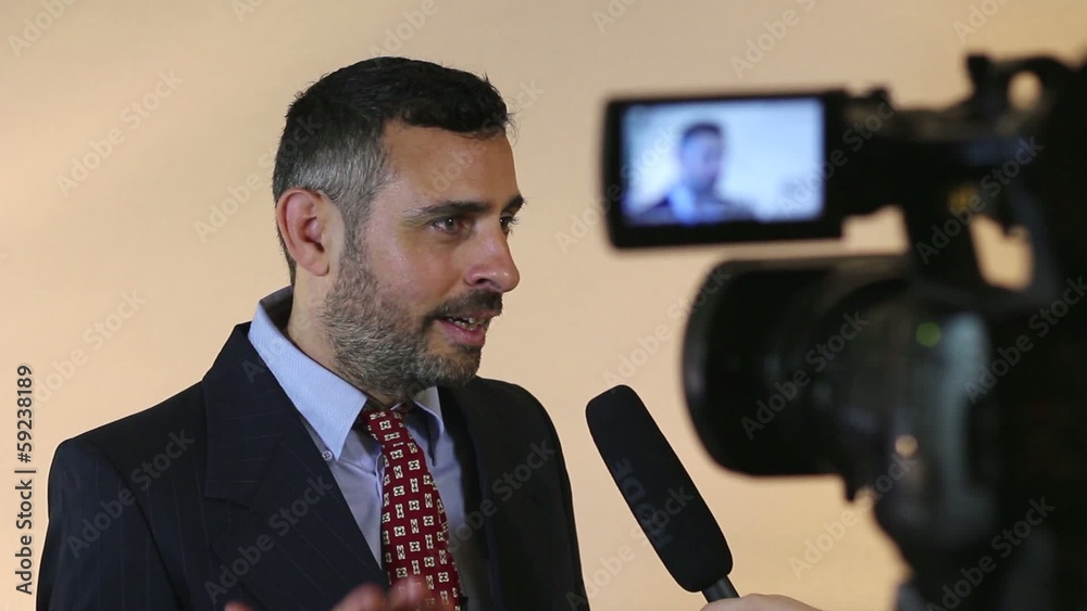 TV Reporter talking to the camera