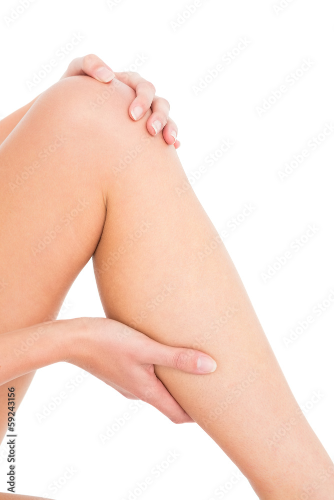 Close-up mid section of a woman with leg pain