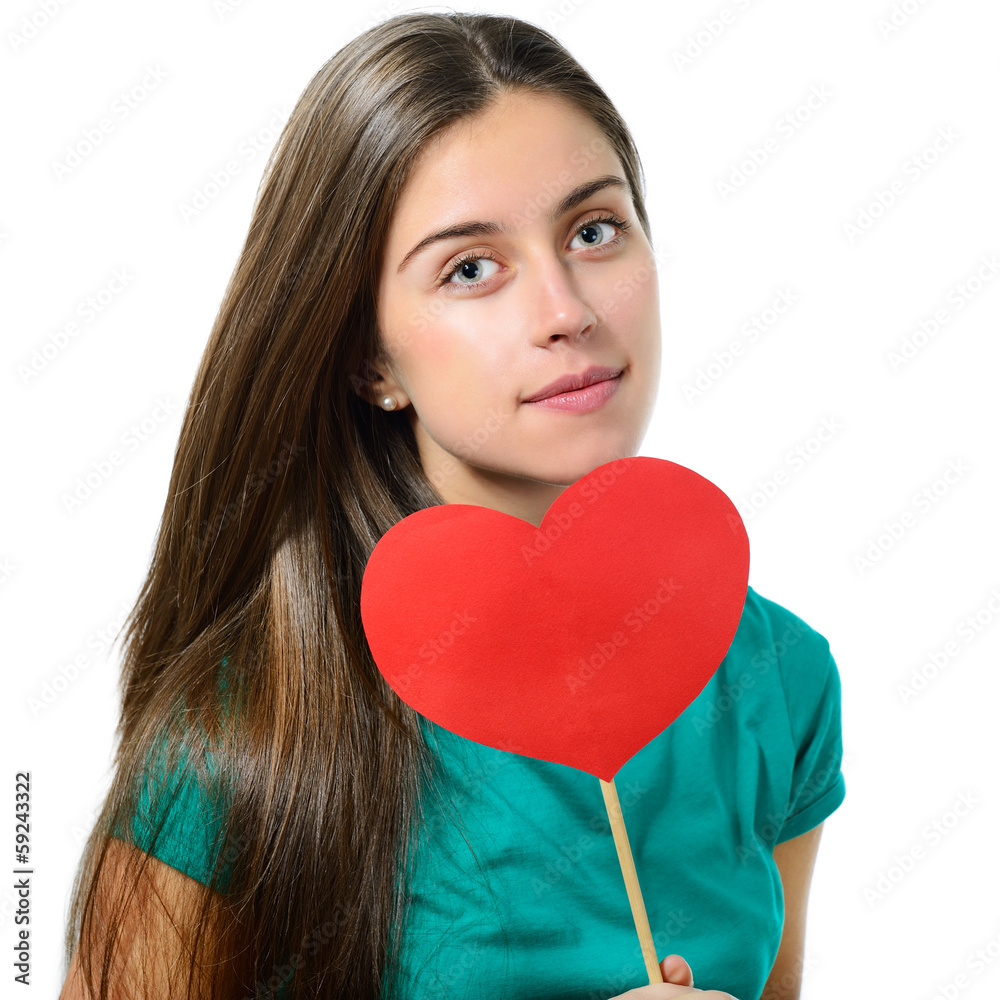portrait of attractive teenager girl showing red heart on valent