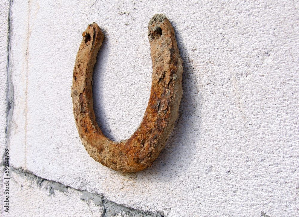 rusty horseshoe on the wall rusty horseshoe on the wall