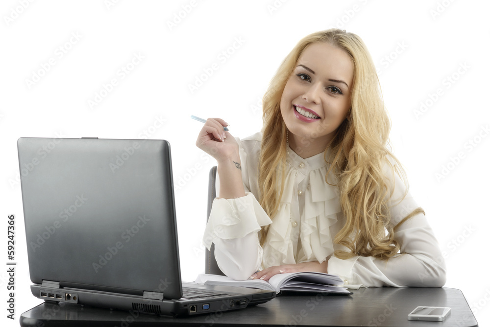 Young pretty business woman with notebook in the office Young pretty business woman with notebook in the office