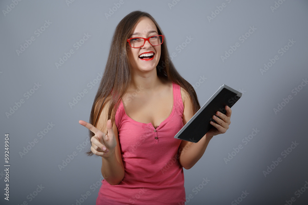 Naklejka premium Happy girl with tablet pc