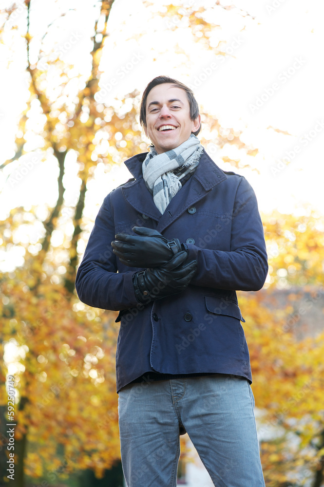 Portrait of a smiling man standing outdoors on a cold day Portrait of a smiling man standing outdoors on a cold day