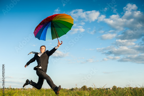 Running with umbrella © Tania Zbrodko