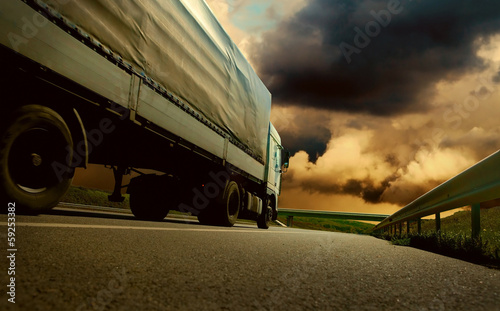 Beautiful view with truckcar on the road  under sky with clouds photo