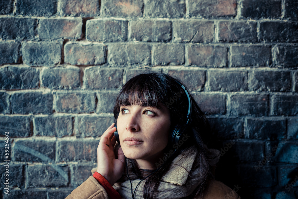 beautiful young woman listening to music headphones