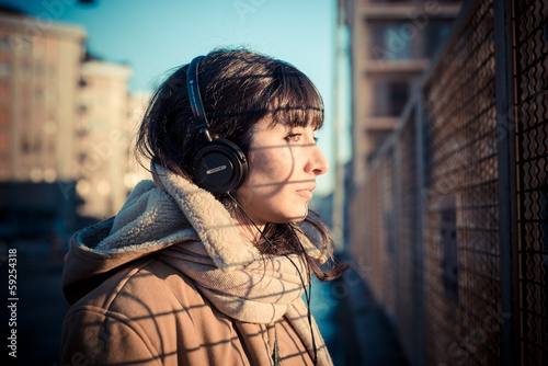 beautiful young woman listening to music headphones