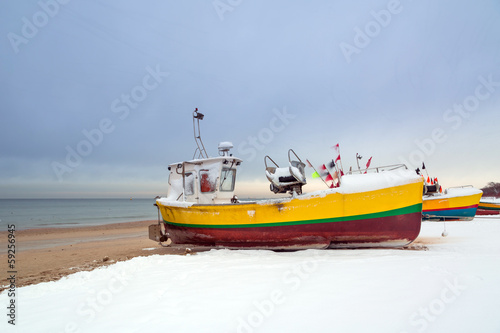 Winter scenery of fishing boats at Baltic Sea in Poland