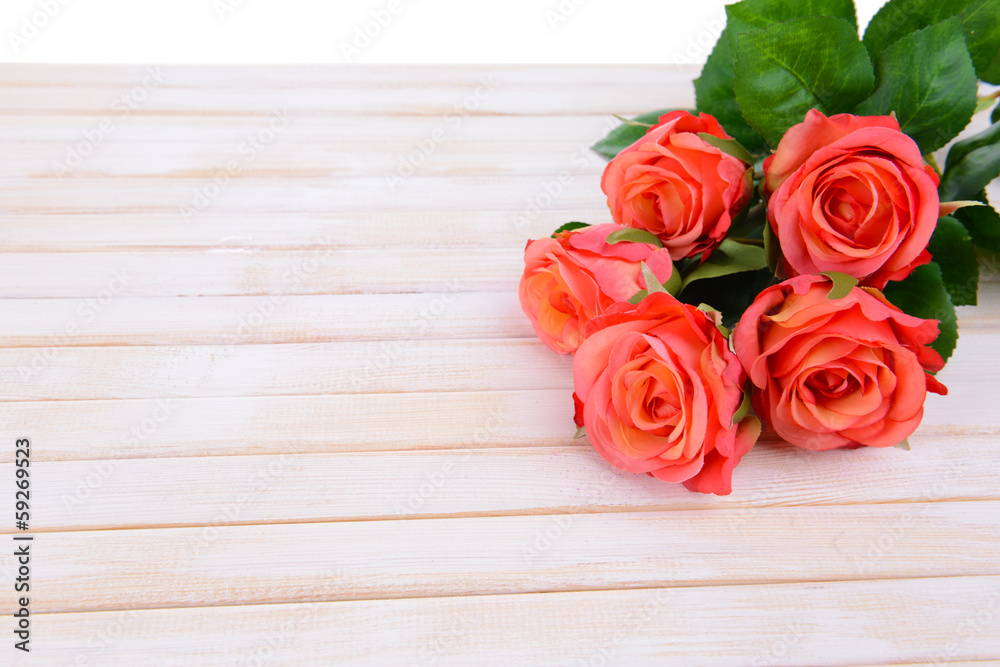 Bouquet of beautiful artificial flowers, on wooden background