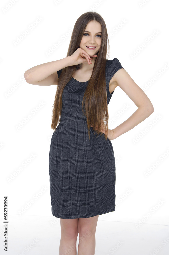 Young girl with long straight hair posing on white background