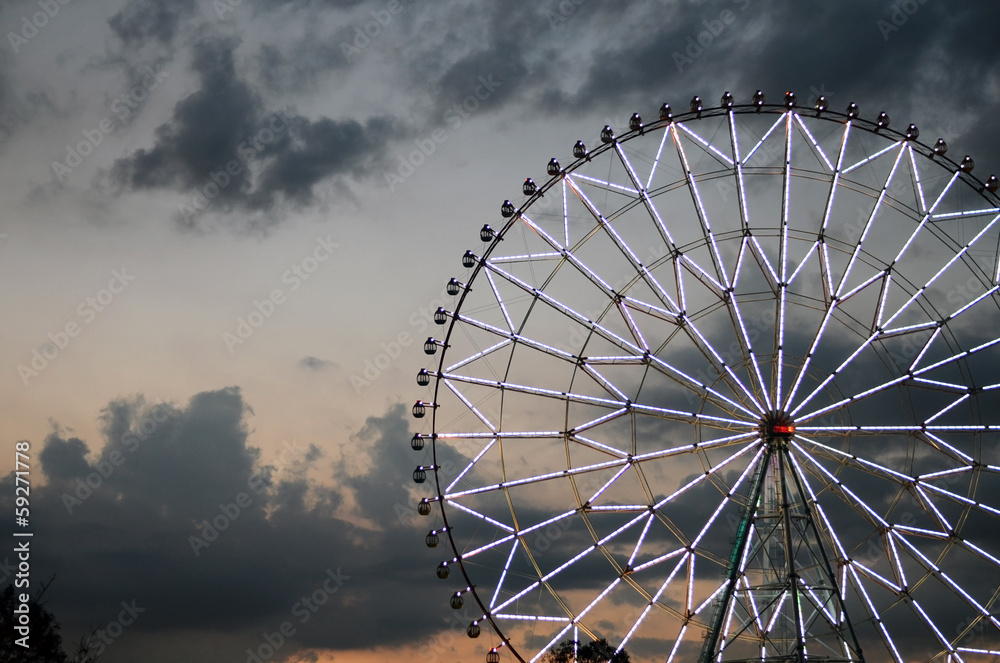 Ferris wheel against the dark sky Ferris wheel against the dark sky