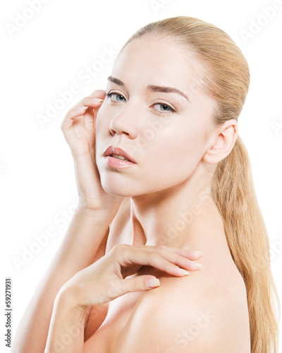 Beauty portrait of young woman  hands touched to face  isolated