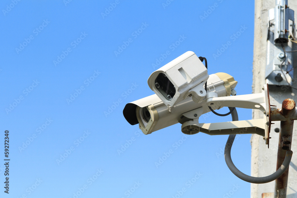 Security camera with blue sky