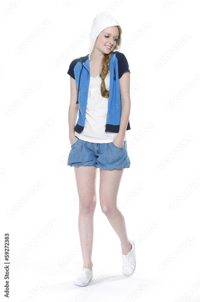 Shot of fashionable girl in leisure clothing posing in studio