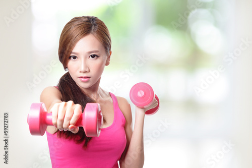 Young sport girl with dumbbells