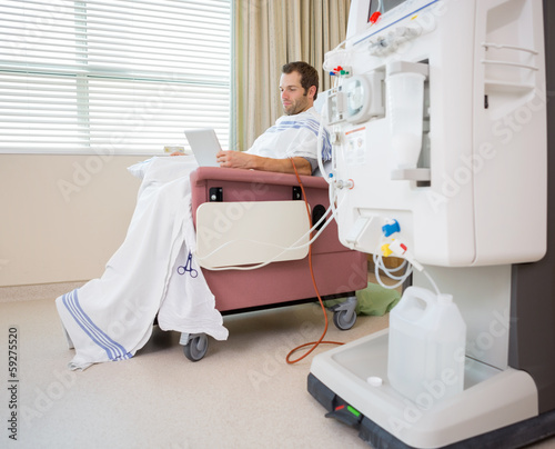 Patient Using Digital Tablet at Dialysis Center