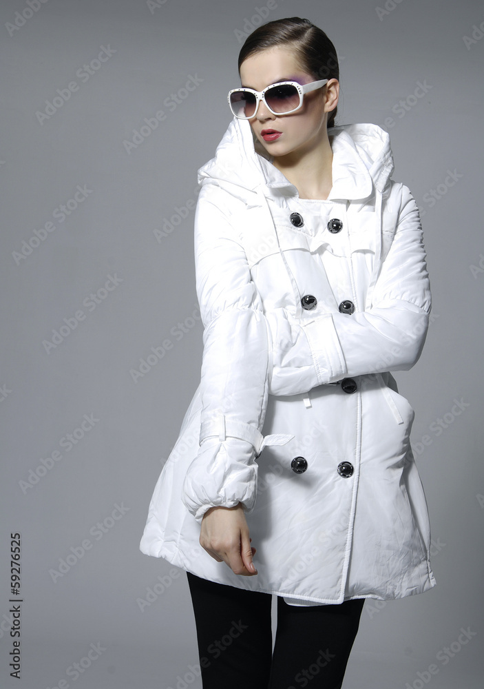 fashion model in white oat dress with sunglasses