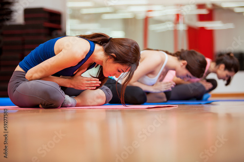 Young women meditating during yoga