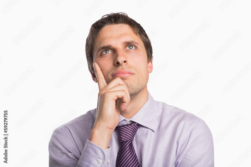 Close-up of a thoughtful businessman looking up Close-up of a thoughtful businessman looking up