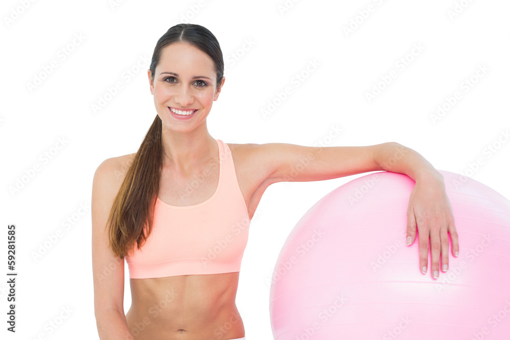 Portrait of a smiling fit woman with fitness ball Portrait of a smiling fit woman with fitness ball