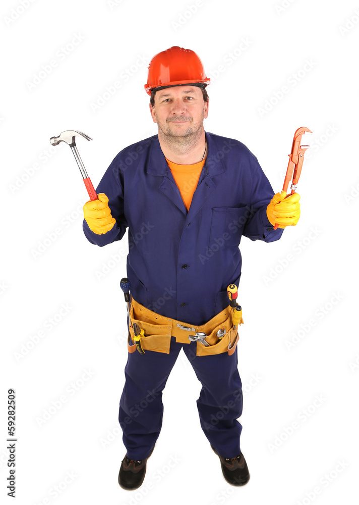 Worker in hard hat holding hammer. Worker in hard hat holding hammer.