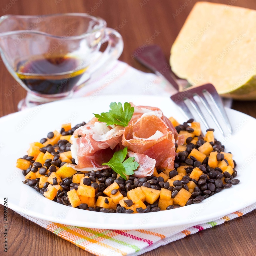Salad with black lentils, jamon ham, pumpkin, soy sauce, tasty Salad with black lentils, jamon ham, pumpkin, soy sauce, tasty
