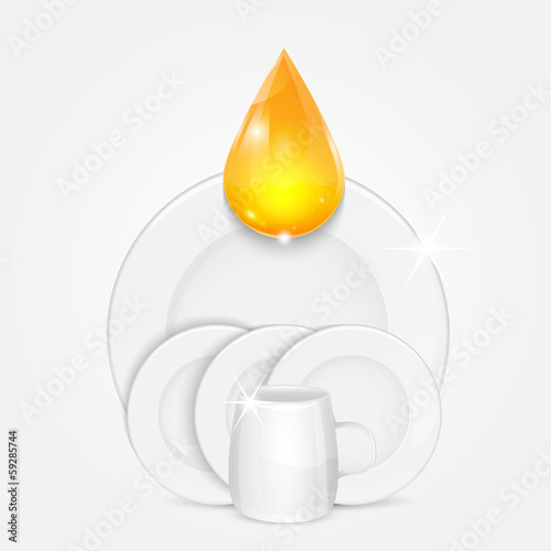 set of clean dishes and yellow drop.dishwashing liquid on the ba