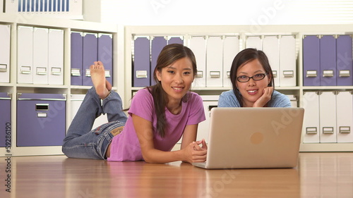 Wallpaper Mural Cute Asian college girls lying on floor Torontodigital.ca