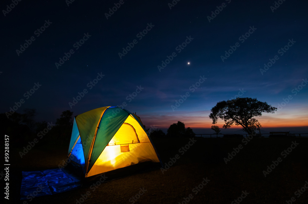 Illuminated Yellow Camping tent at Night, Thailand.