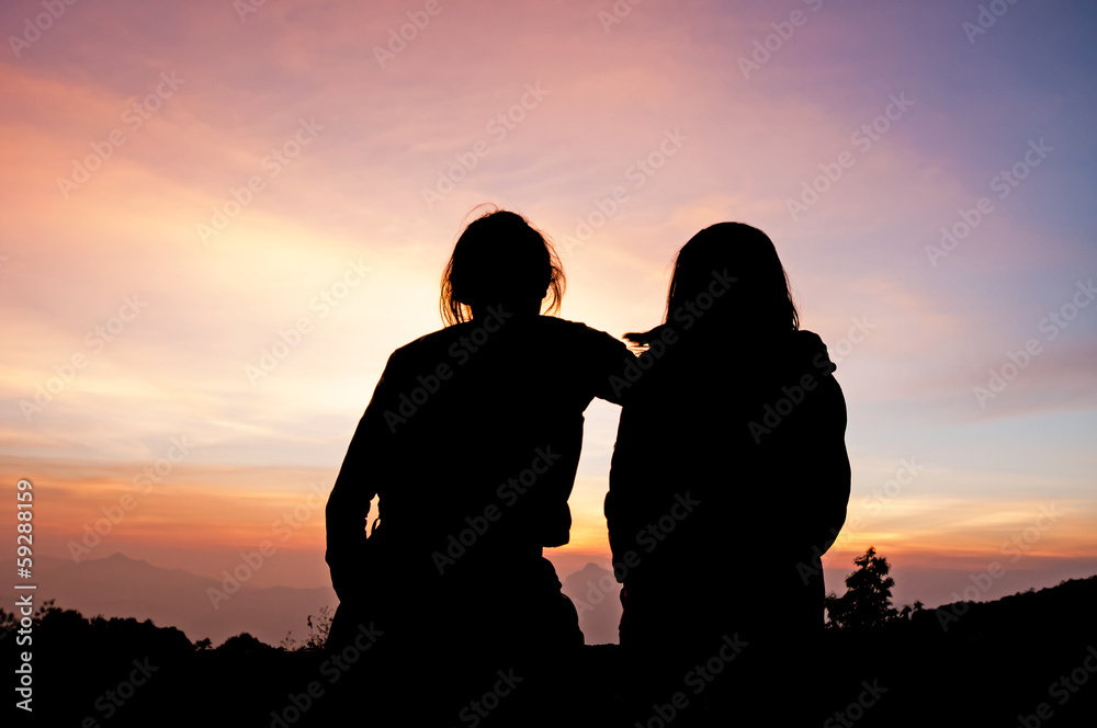 Young couple enjoying the sunset