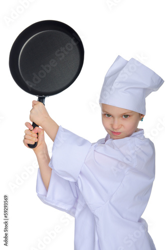 Young chef threatens frying pan