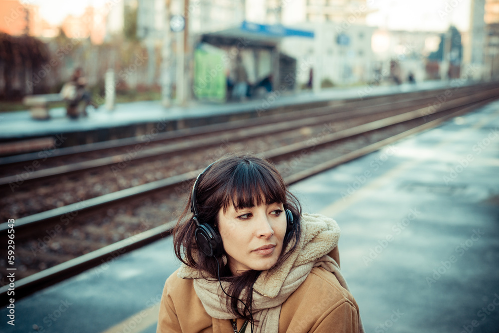 beautiful young woman listening to music headphones