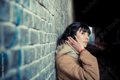 beautiful young woman listening to music headphones